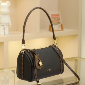 Alternative view of 17 x 13.5 x 26 cm (H x W x L) Cowhide-coated canvas trim Cotton lining Metal hardware Dual zipper closure Removable key pouch and detachable padlock (attaches to zipper pull) Shoulder strap:Removable, adjustable Strap half-length: 41.0 cm Adjustable to: 47.0 cm Handles: Dual handles